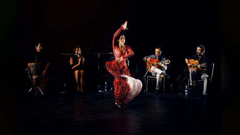 Dancer performing with live musicians on stage, Tirgan 2013
